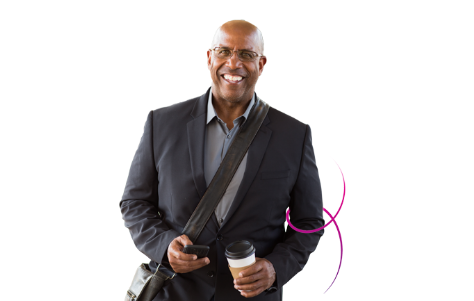 Man standing with coffee cup and cell phone