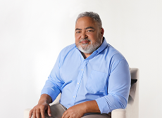 KRYSTEXXA patient Chance sitting in a chair