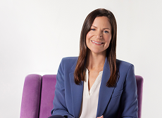 PAL Loni sitting wearing a blue blazer